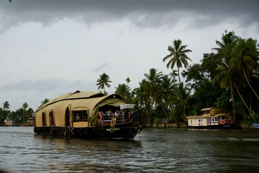 A traditional kettuvallam houseboat on the backwaters